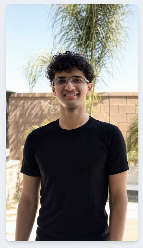 Shraman's source selfie, wearing glasses and a black T-shirt, used to create the custom avatar in the ten example videos